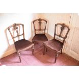 A part set of three Victorian carved walnut dining chairs, and two further walnut dining chairs (5).