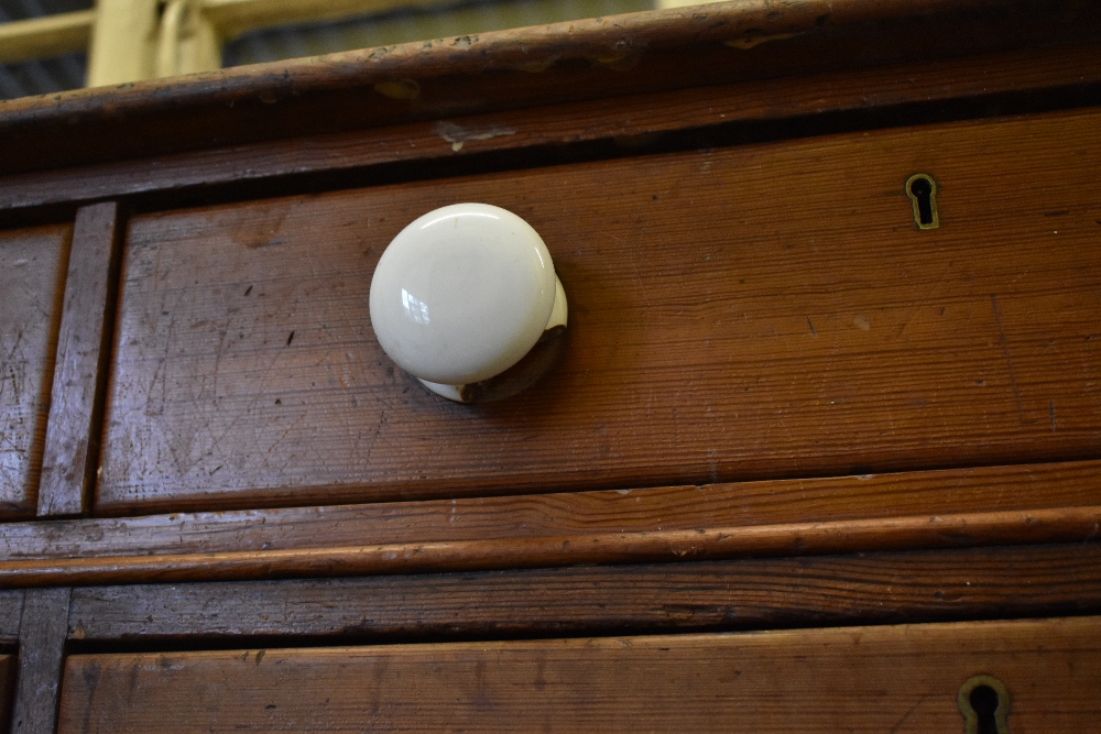 A Victorian pine chest of two rows of four graduated long drawers, with ceramic handles, on plinth - Image 5 of 7