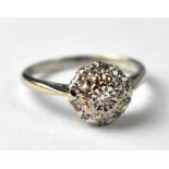 An 18ct white gold and diamond cluster ring, approx 3.5g.