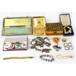 A quantity of costume jewellery to include a garnet and silver necklace,