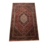 A 20th century heavy Middle Eastern rug with decreasing lozenges,