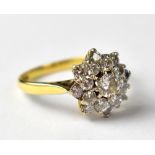 An 18ct gold diamond flower cluster ring, the head arranged as a flower,