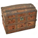A 19th century metal bound leather covered dome topped trunk, with metal mounts and locks,