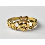 A 9ct gold claddagh ring set with small diamond.