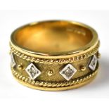 A 9ct gold diamond band ring,