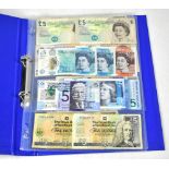 An album of various collectible banknotes to include a £1 note series C,