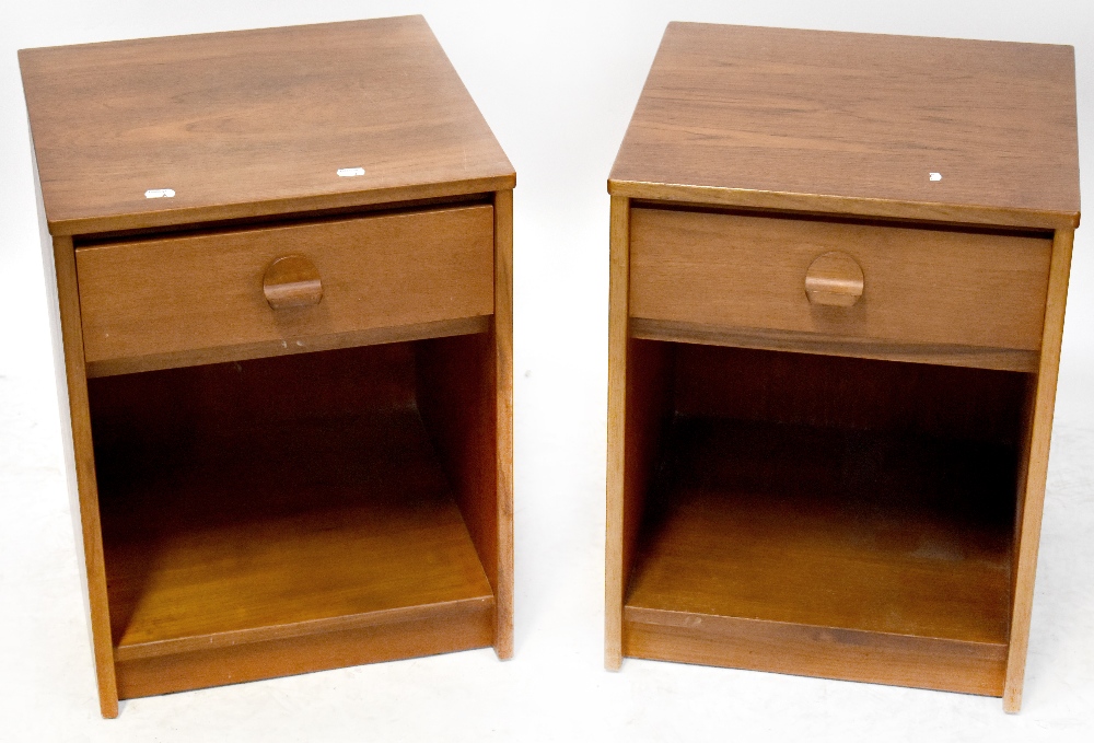 A pair of Stag teak bedside cabinets, each with a single drawer above open recess,