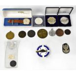 A small quantity of commemorative coins and medals including a 1990 Steenbergen Memorial,