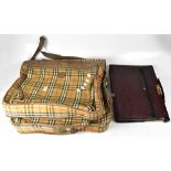 BURBERRY; a vintage fold-over suit carrier in Burberry check with brown leather trim,