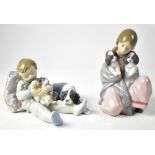 LLADRÓ; two figurines, young girl kneeling with two puppies,