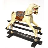 A vintage dappled cream painted rocking horse with grey mane and tail,