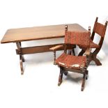 A mid-20th century oak Jacobean-style dining table with slab end supports and six matching dining