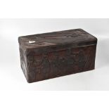 A 20th century African carved hardwood casket, the top carved with two crocodiles,