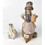 LLADRÓ; two figures, a young girl carrying a basket containing chicks, height 25cm,