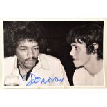 DONOVAN; a signed photograph of Donovan with Jimi Hendrix, signed by Donovan.