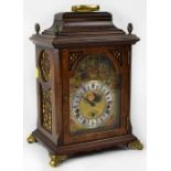 A 20th century modern Dutch reproduction burr walnut effect chiming mantel clock,