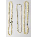 A single strand of well matched pearls with a 9ct white gold any tiny diamond set clasp,