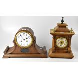An early 20th century oak dome topped mantel clock, the enamelled dial set with Arabic numerals,