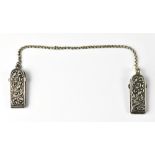 A set of 19th century white metal nurse's cloak clips united by a white metal belcher chain,