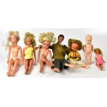 A quantity of vintage and later plastic dolls of various sizes and outfits and a Palitoy Action Man.