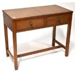 A contemporary oak two-drawer side table, raised on square section stretchered supports,