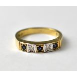 A 9ct gold ring set with two diamonds and three sapphires, approx 2.8g.