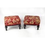 Two Victorian footstools with burgundy tapestry top to turned supports (2).