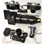 Various cameras to include a Kodak 25BT50 field camera, a Praktica IV F camera, a Pentax Spotmatic,