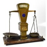 A pair of Burtons Autobac scales with blue circular maker's plaque to the middle of the metal