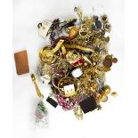 A large quantity of mixed costume jewellery to include fashion watches, necklaces, compacts, rings,