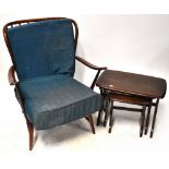 ERCOL; a set of three oak tables and an Ercol oak armchair,