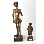A 20th century Continental carved wooden figure of Don Quixote holding a spear,