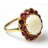 A late 19th/early 20th century 9ct gold opal and ruby cluster ring,