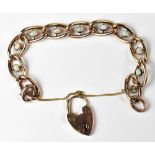 A vintage 9ct gold and opal oval link bracelet, each link with collet set oval opal,