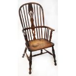 A 19th century country made spindle back Windsor elbow chair,