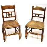 A group of five similar 19th century provincial country-style chairs, each with rush seats,