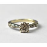 A 9ct white gold diamond cluster ring.