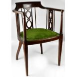 An Edwardian mahogany desk chair with string inlaid back rail,