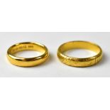 Two vintage 22ct gold wedding bands, the smallest marked 22ct, size G, the other marked 916 (22ct),