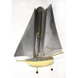 A Bunting 'Yacht' sailing yacht shaped heater, manufactured by Bunting, McConnell & Co Ltd,