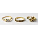 Three 9ct gold fashion rings to include a seven-stone sapphire half eternity ring, size M,