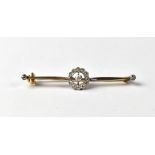 An Edwardian 9ct gold bar brooch with florally set diamond centre,