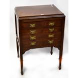 An Edwardian mahogany four-drawer music/document cabinet to tapering supports and peg feet,