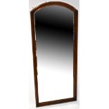 A 19th century mahogany cheval-style wall mirror, with domed top and straight sides,