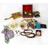 A quantity of costume jewellery to include brooches,