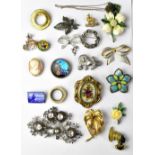 A quantity of mainly costume brooches to include a yellow and white metal bow brooch,