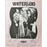 ABBA; a music score for 'Waterloo', bearing the signatures of the four stars, 28 x 21.5cm.