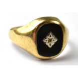 A gentlemen's vintage black onyx signet ring with a centred white metal star (lacking tiny stone),