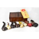 A small collection of smoking paraphernalia to include an oak three-division tobacco box,