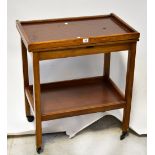 A 20th century oak-framed fold-over tea and games trolley with teak shelves,